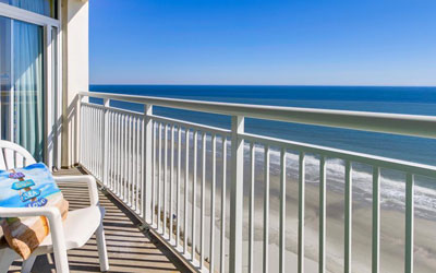 Stylish 4-Bedroom Condo Boasting Stunning Coastal Views and Beach Access